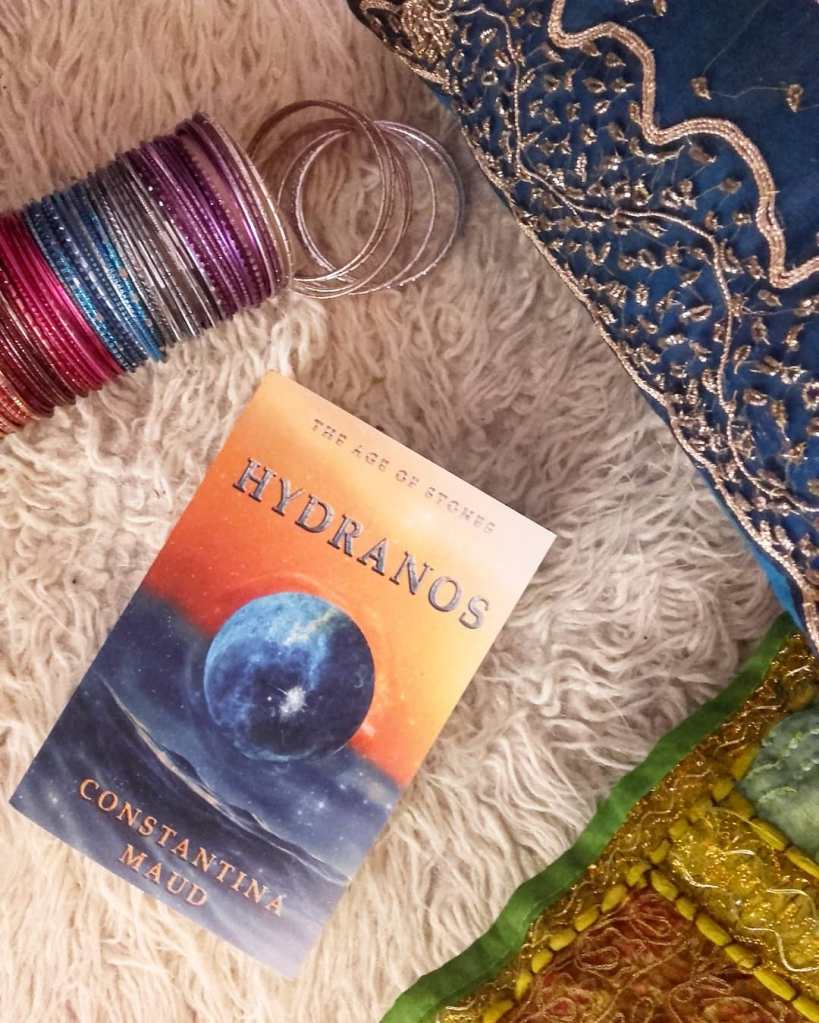 Hydranos fantasy book with boho Indian cushions and colorful bangles